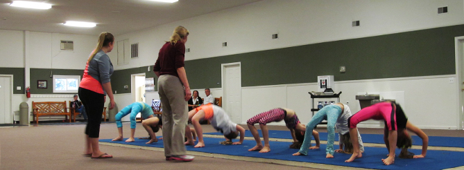 Gymnastics Class doing Backbends