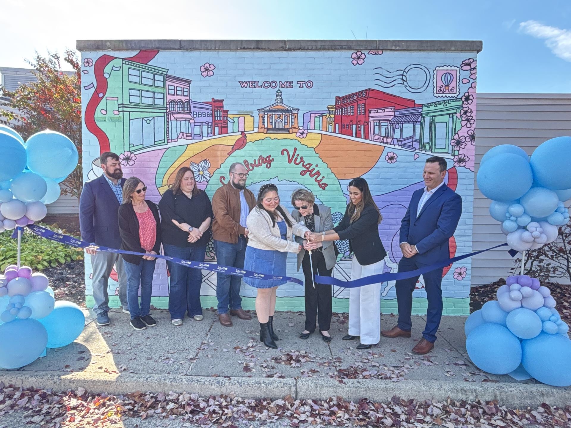 Ribbon cutting for private property mural at Leesburg Premium Outlets