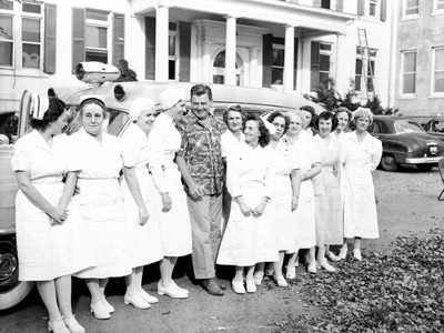 Arthur Godfrey and Loudoun Hospital nurses with new ambulance, 1952